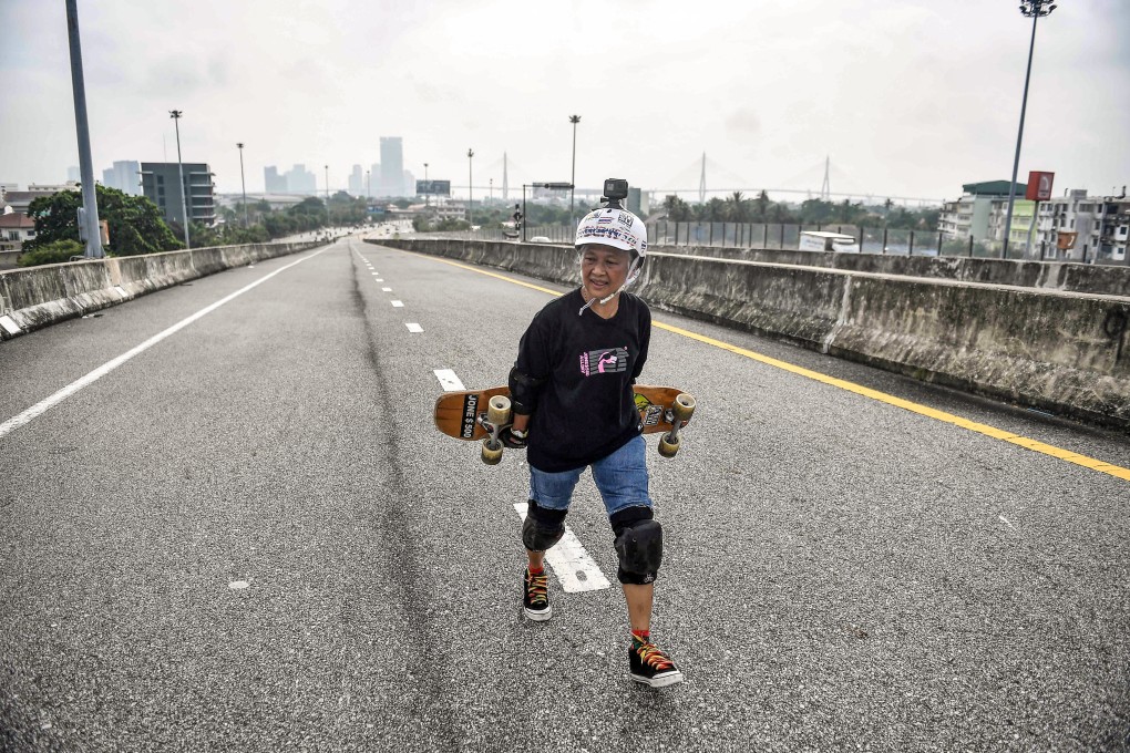 Skateboarder and cancer survivor Nongluck Chairuettichai says taking up the longboard set her on the road to recovery from breast cancer. At 63, Nongluck is the oldest member of Thailand’s longboard national team. Photo: AFP