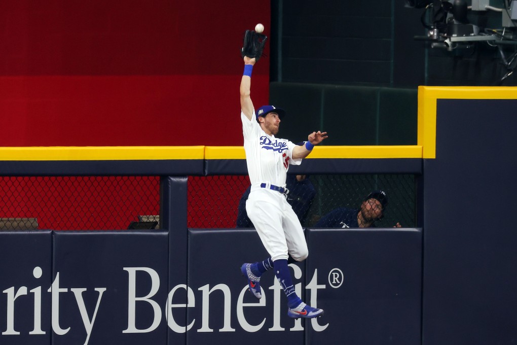 Cody Bellinger of the Los Angeles Dodgers catches a fly ball during game one of the World Series. Photo: AFP