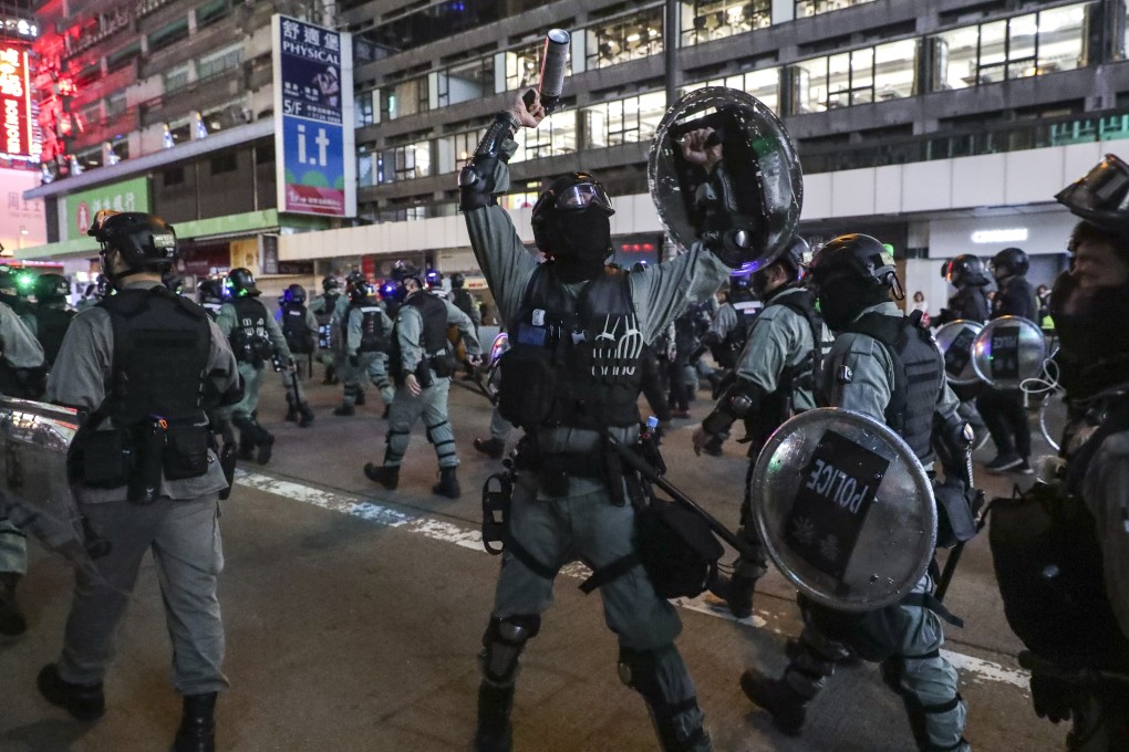 Riot police confront anti-government protesters on Nathan Road, in Mong Kok, last December. Photo: Edmond So