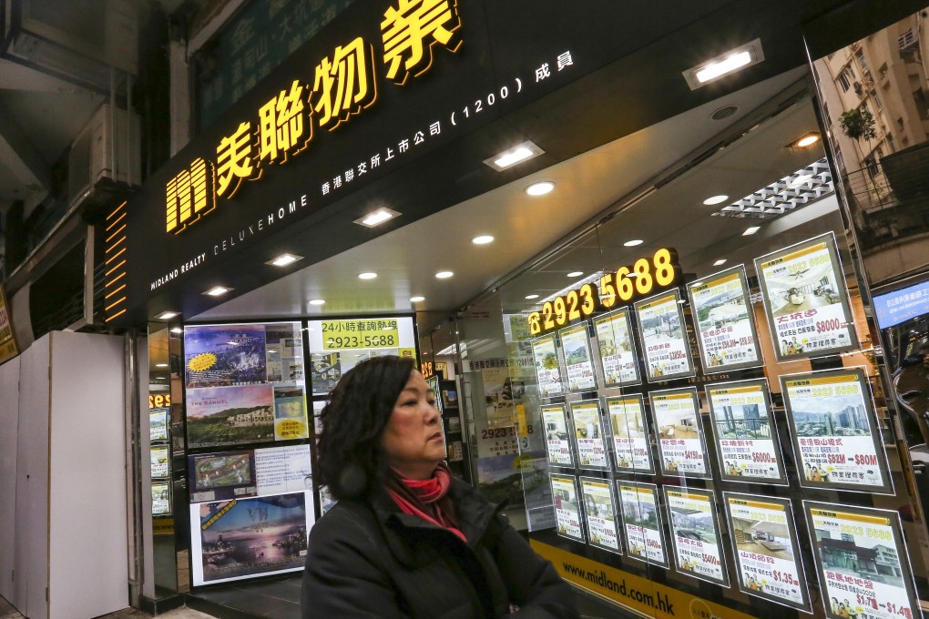 Property listings on display at a Midland agency in Happy Valley, Hong Kong. Photo: Jonathan Wong