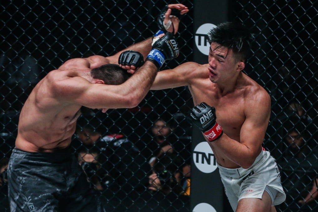 Christian Lee punches Dagi Arslanaliev at ONE: Century in Tokyo. Photos: ONE Championship