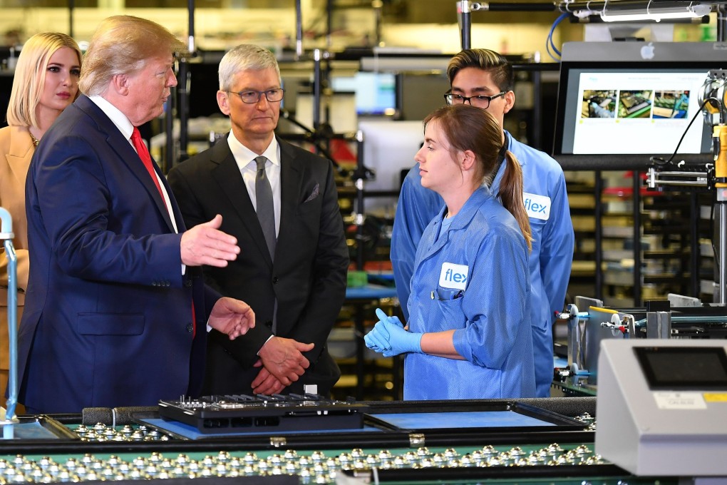 US President Donald Trump and Apple CEO Tim Cook tour the Flextronics manufacturing facility where Apple’s Mac Pros are assembled in Austin, Texas. Photo: AFP via Getty Images