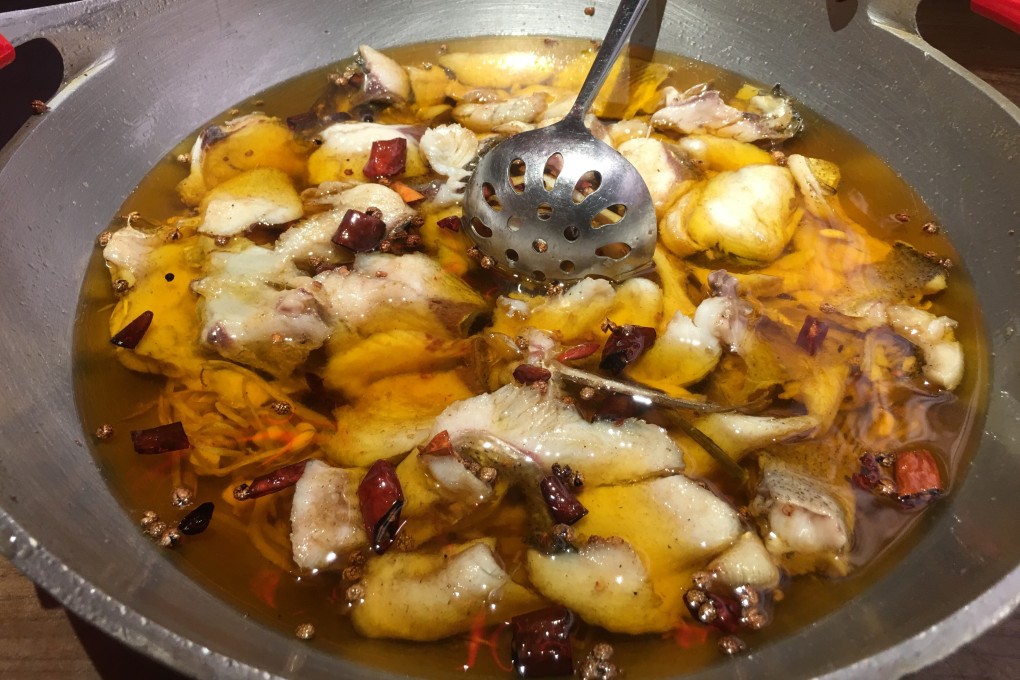 Sichuan water-boiled fish, or shui zhu yu, after the top layer of chillies has been spooned off, at Longrenju Three Gorges Water-boiled Fish in Beijing, China. Photo: Elaine Yau