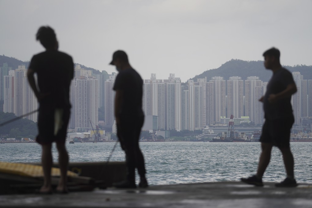 People fishing in front of private housing in East Kowloon. Photo: Winson Wong