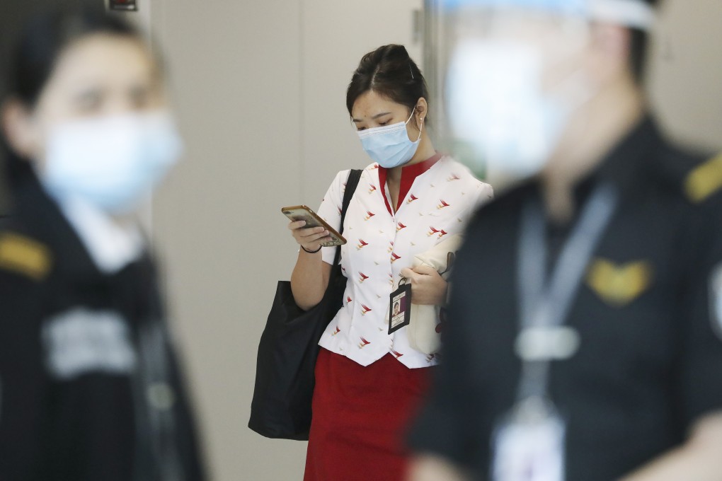 Cathay Pacific cabin crew members who dodged recent lay-offs are now considering whether to accept much diminished pay packages. Photo: K. Y. Cheng