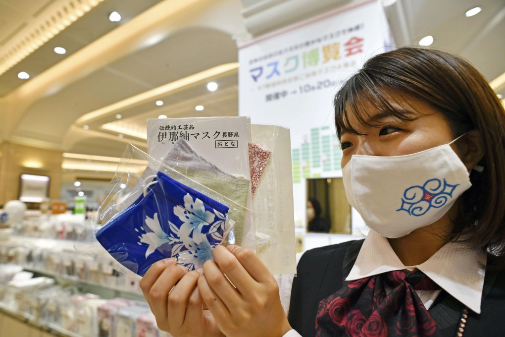 A department store employee wears a face mask in Osaka on October 7. Photo: Kyodo