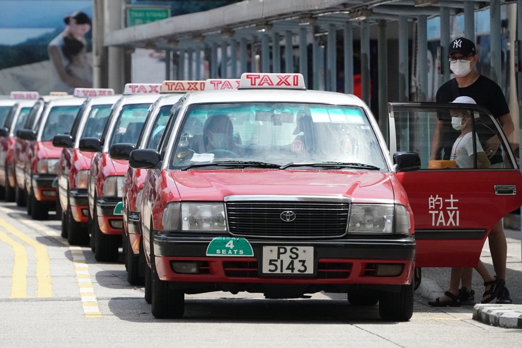 A long queue of taxis sit in line as they wait for customers. Photo: Felix Wong