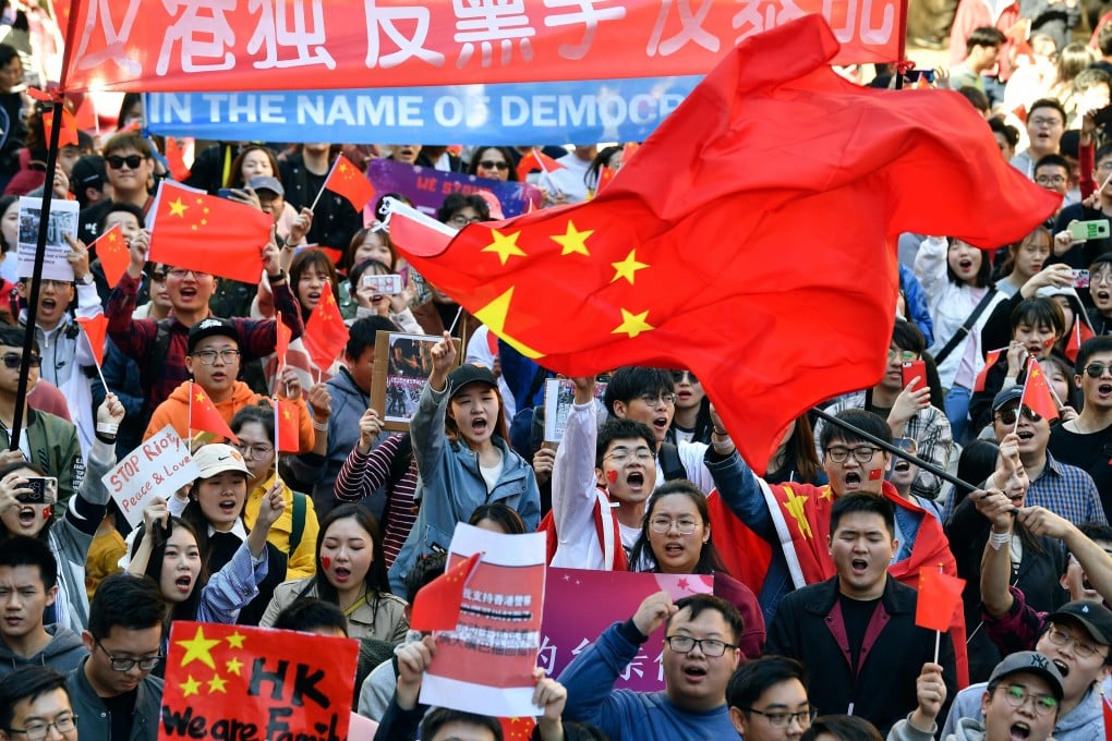 Pro-China activists march through the streets of Sydney on August 17, 2019, as they rally against anti-government protests in Hong Kong. Photo: AFP