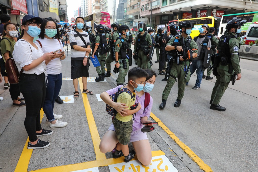 Police officers stand guard on Nathan Road in Hong Kong in September during protests against the new national security law. Photo: May Tse