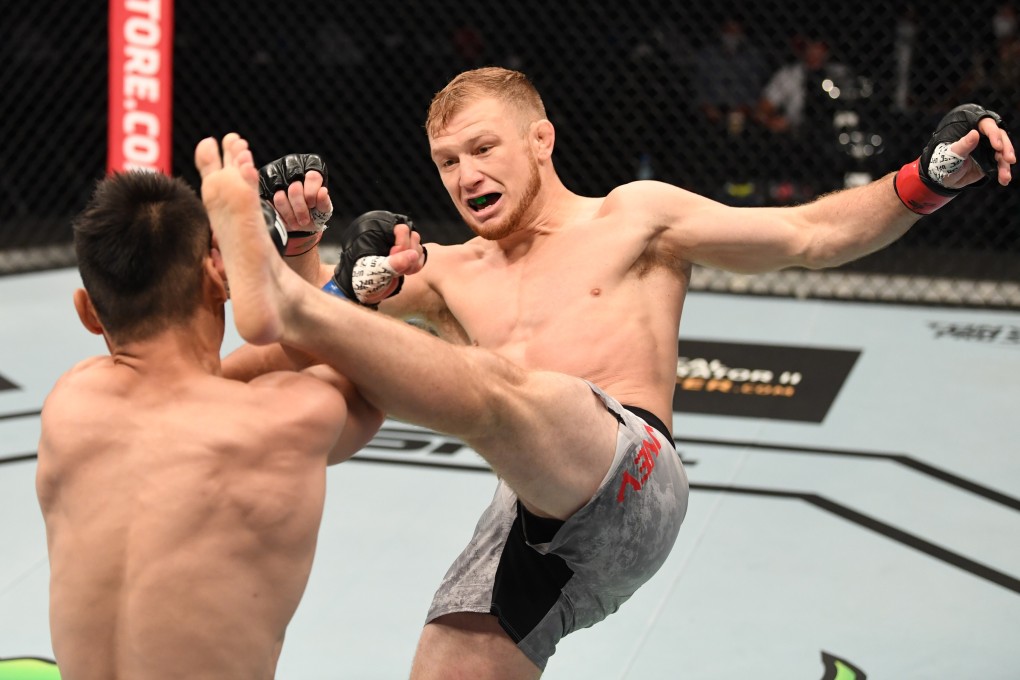 Casey Kenney kicks Alateng Heili in their bantamweight bout during the UFC Fight Night event inside Flash Forum on UFC Fight Island on October 04, 2020 in Abu Dhabi, United Arab Emirates. Photos: Josh Hedges/Zuffa LLC
