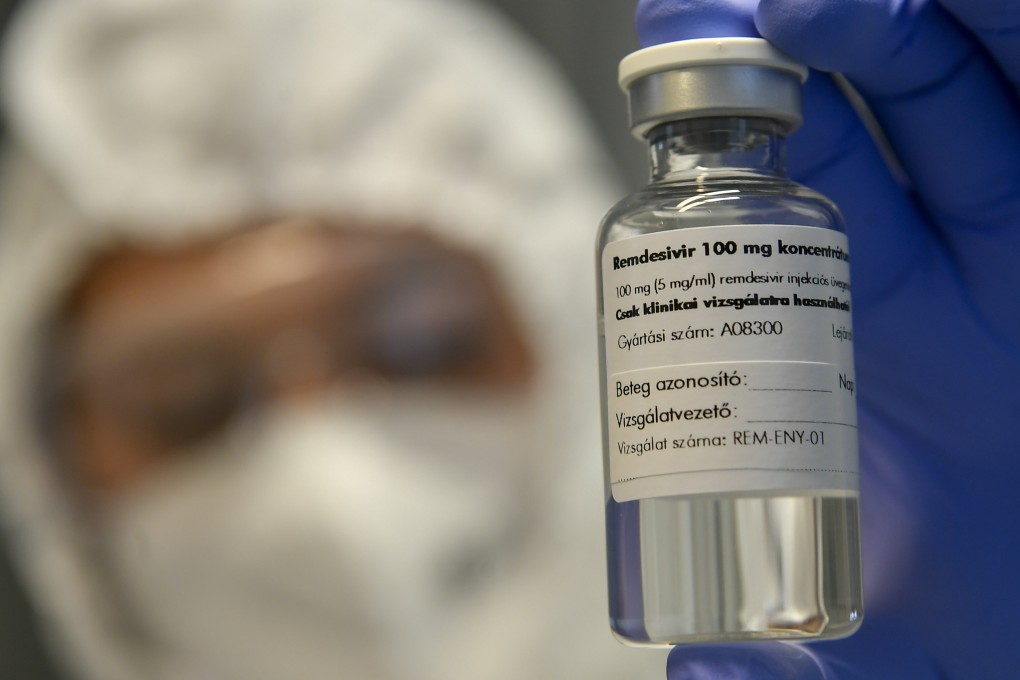 A bottle containing Remdesivir is held by a health worker in Debrecen, Hungary on October 15. Photo: MTI via AP