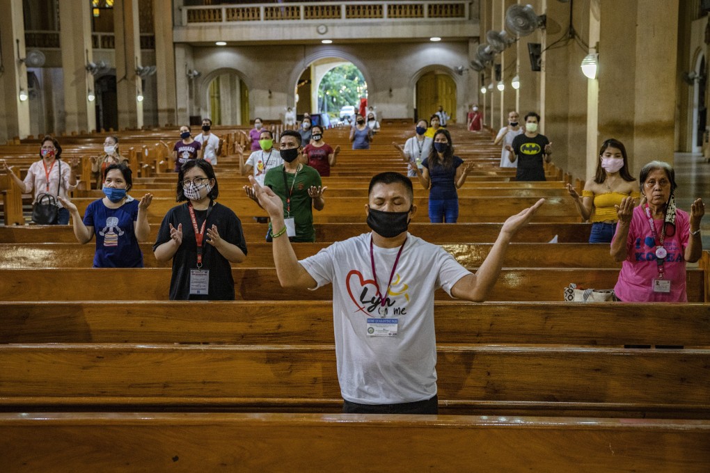 Worshippers stand far apart from one another as they take part in Sunday service at a church in the Philippines. The pandemic has seen many Filipinos turn to their faith to cope, but mental illness is still seen by some in the community to reflect a lack of religious devotion. Photo: Getty Images