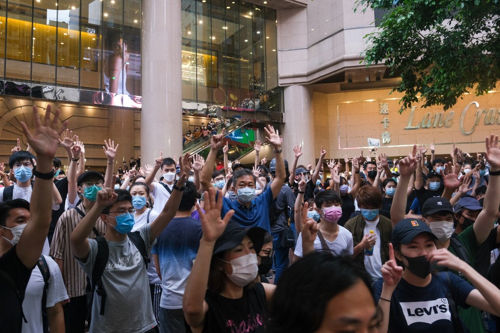 Protesters hold up their hands to signify their demands at a demonstration in Causeway Bay on July 1, when the new national security law came into force in Hong Kong. Photo: Bloomberg