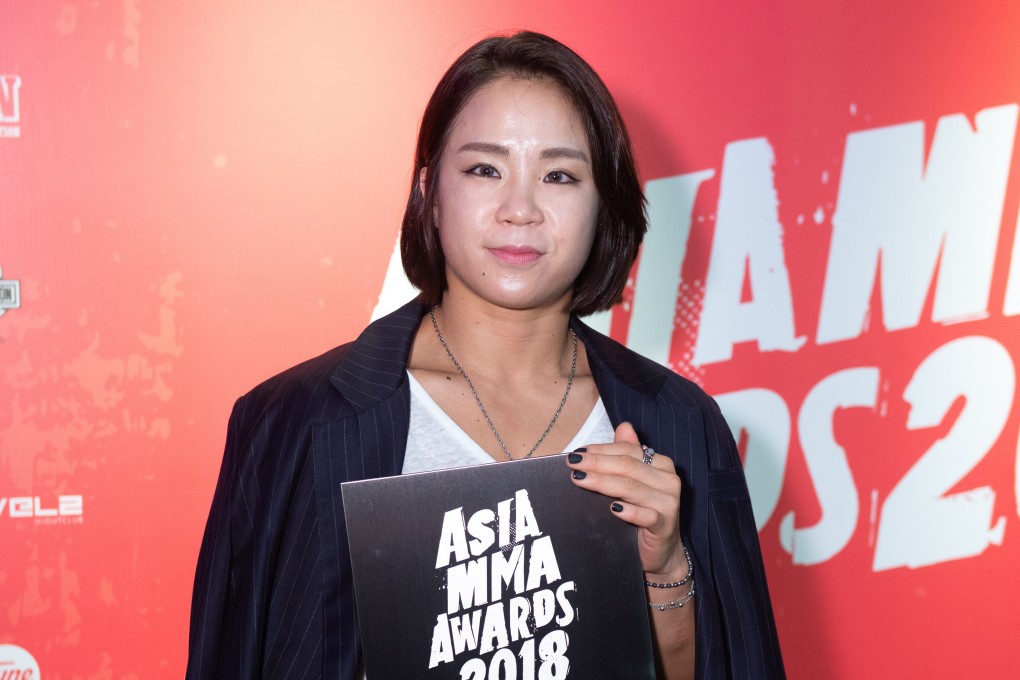 Ham Seo-hee poses with her Best Female Fighter award at the 2018 Asia MMA Awards in Hong Kong. Photo: SingaporeMaven