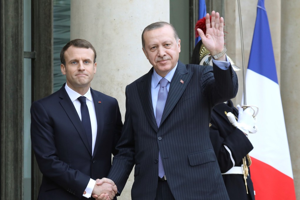 French President Emmanuel Macron (L) with his Turkish counterpart Tayyip Erdogan at the Elysee Palace in Paris in 2018. Photo: AFP