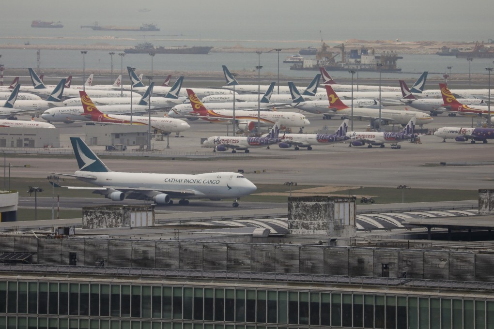 Planes sit grounded on the tarmac at Hong Kong International Airport on March 20. Cathay Pacific and Cathay Dragon are the latest to experience steep job losses as the ongoing pandemic leaves carriers around the world facing severe financial difficulties. Photo: Winson Wong