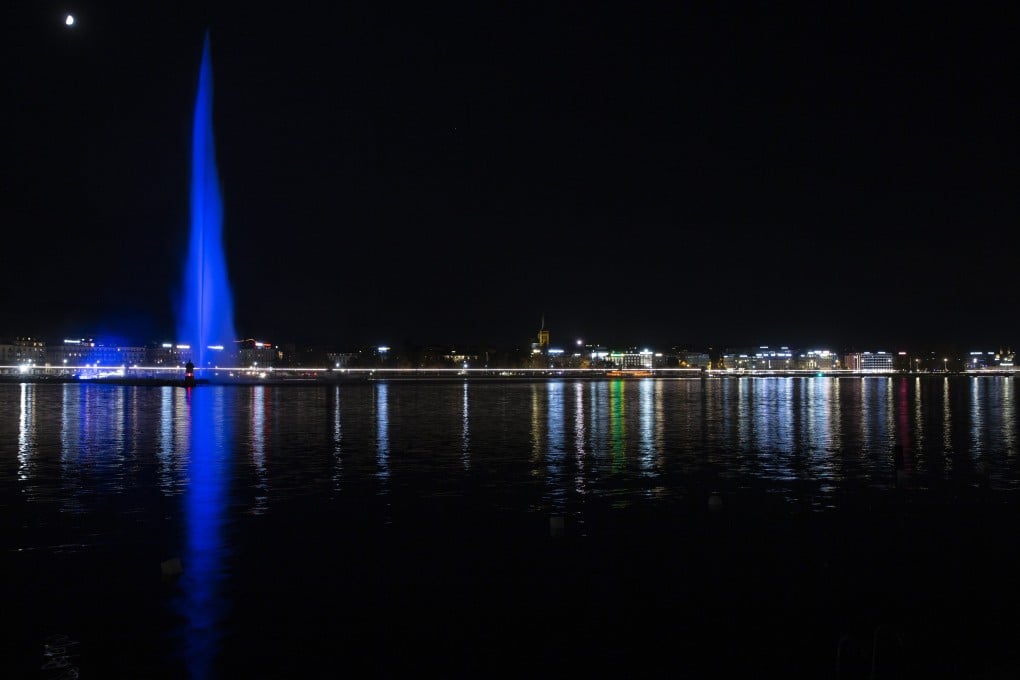 The water fountain 'Le Jet d‘eau' illuminated in blue to mark the 75th anniversary of the United Nations in Geneva, Switzerland on Saturday. Photo: EPA-EFE
