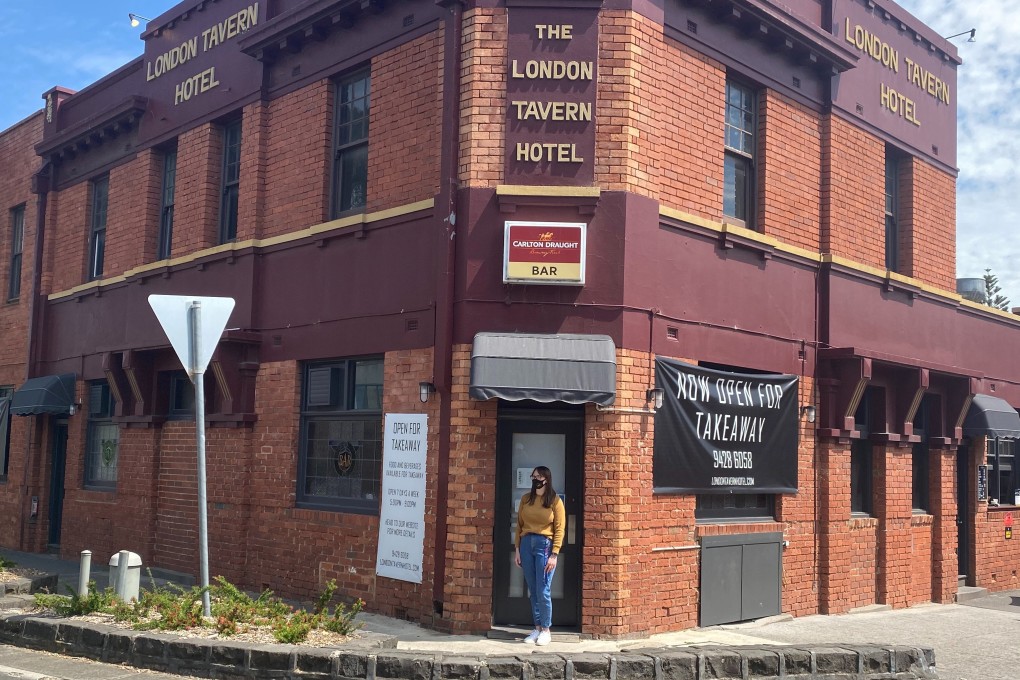 The manager of the London Tavern Hotel now runs a skeleton business of takeaway coffee and snacks. Photo: Reuters