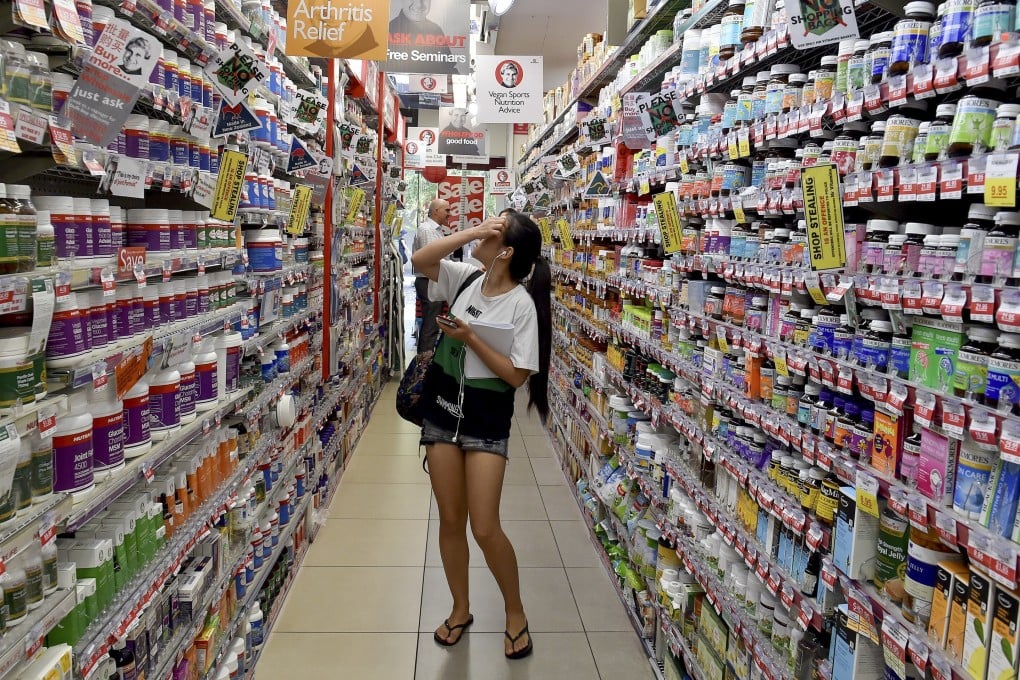A customer browses products at Mr Vitamins, a supplements store in Sydney, Australia. Experts say taking some supplements can be necessary for some people. Photo: AFP