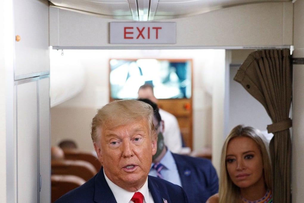 President Donald Trump talks with reporters aboard Air Force One. Photo: Reuters