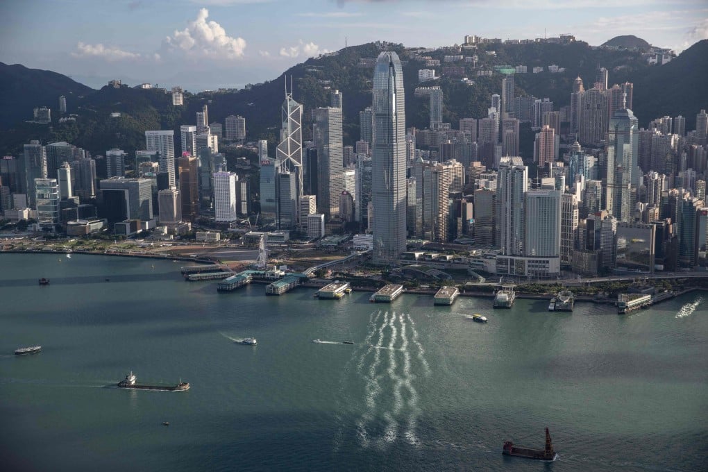 Hong Kong seen in the background of Victoria Harbour. Competition for investment banking advisory roles has intensified as Chinese firms waded into the market as part of their international expansion. Photo: AFP