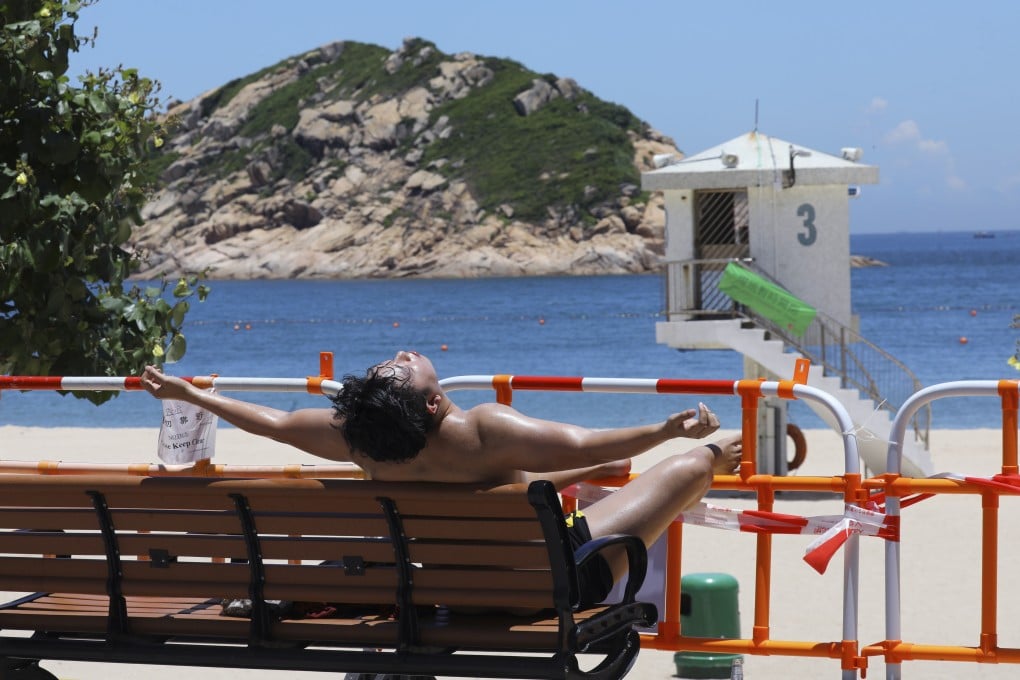 A man enjoys the sun but not the beach at Shek O. Photo: Dickson Lee