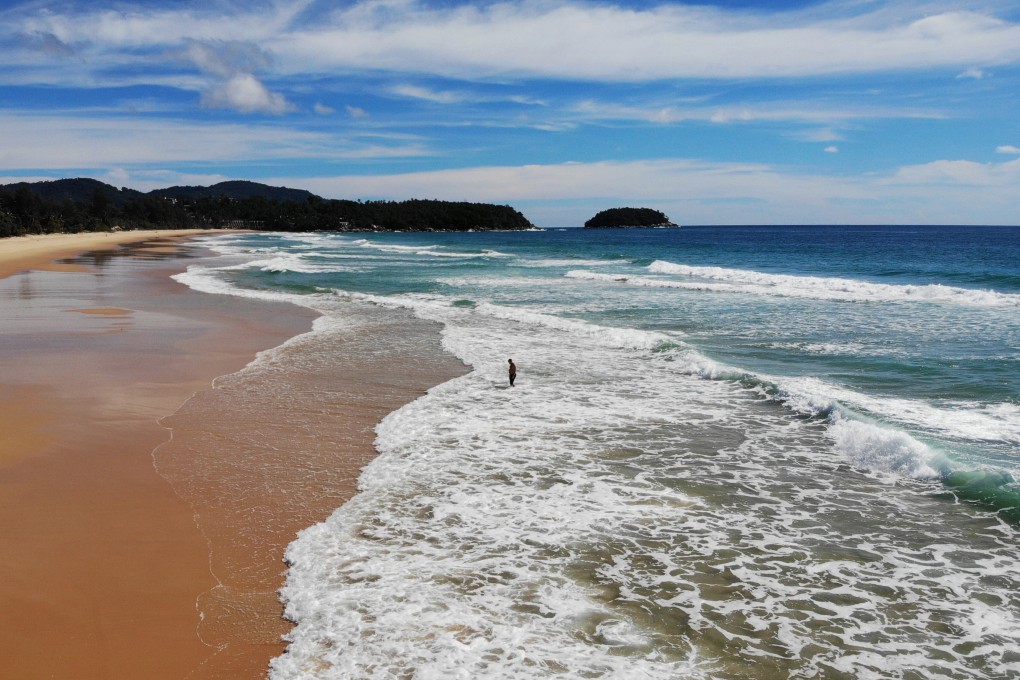 Karon beach in Phuket. With tourism almost at a standstill in Phuket, and plans to reopen the island to foreign holidaymakers put on hold, thousands of tourism workers have left for their home provinces, businesses have shut, and 50,000 hotel jobs are at risk. Photo: AFP
