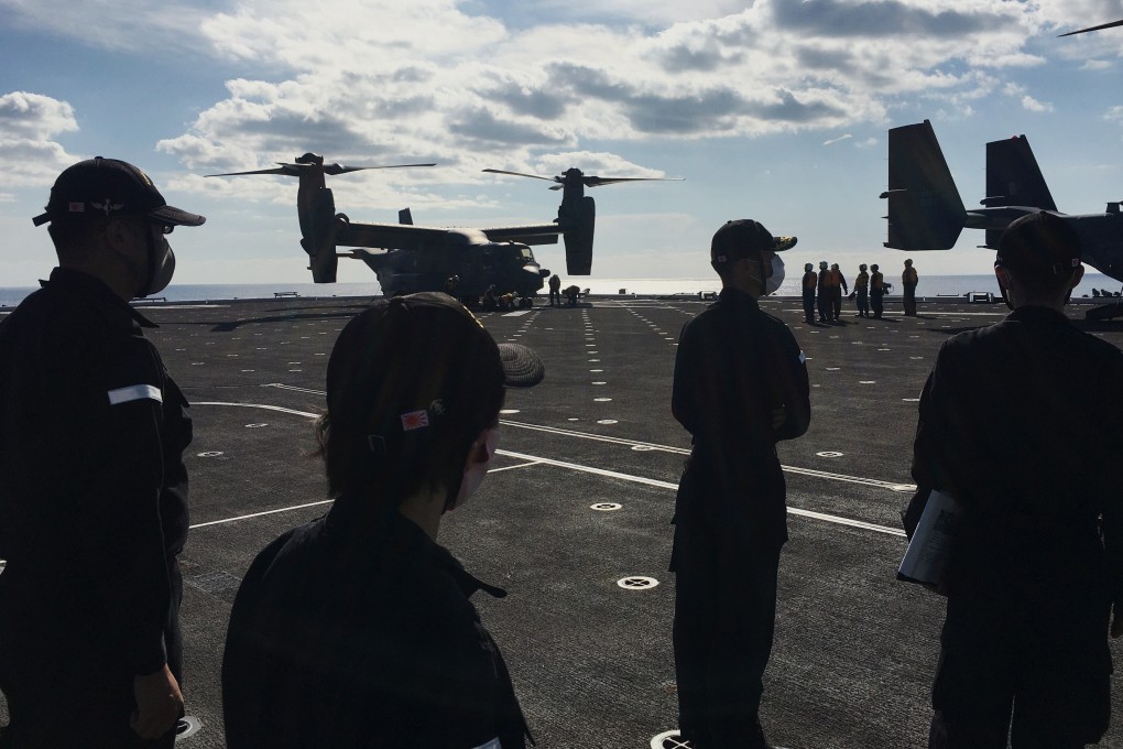 Defence force personnel on board the helicopter destroyer JS Kaga during Keen Sword on October 26, 2020. Photo: Reuters