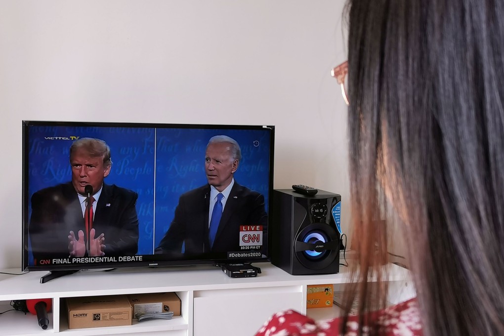 A woman in Taipei watches the final presidential debate at her home last week. The Biden-Trump divide is evident even in Taiwan, where Trump has garnered support for his anti-China stance and Biden is viewed as capable of bringing stability to the region. Photo: CNA