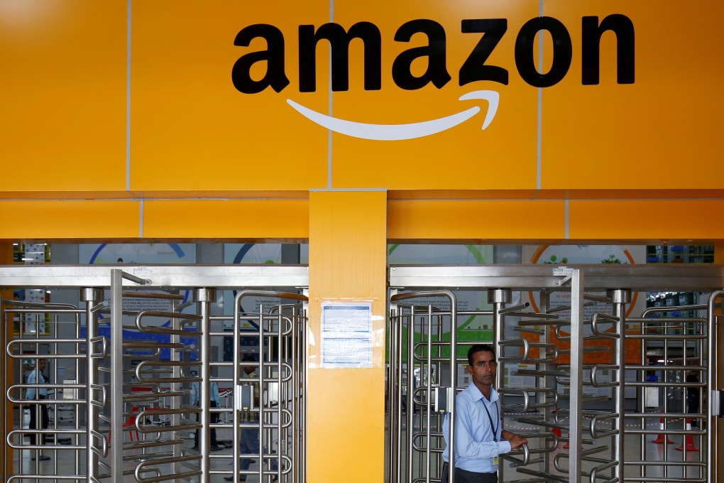 An employee of Amazon India walks through a turnstile gate inside an Amazon Fulfilment Centre on the outskirts of Bangalore on September 18, 2018. Photo: Reuters