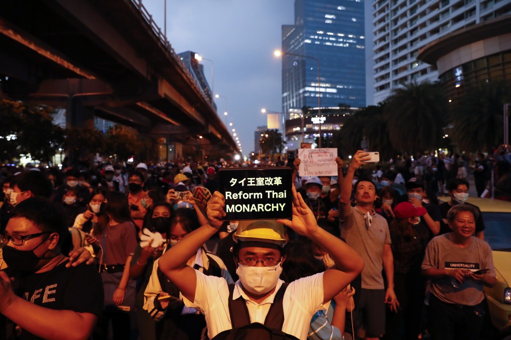 Pro-democracy demonstrators march to the German Embassy in central Bangkok on Monday as lawmakers debated in a special session in parliament. Photo: AP