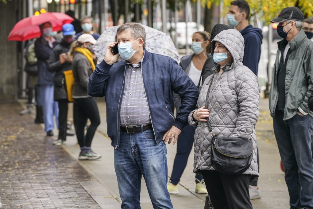 People line up outside an early voting site near Lincoln Center in Manhattan on Monday. Early voting ahead of the November 3 general election has surged across the country. Photo: AP