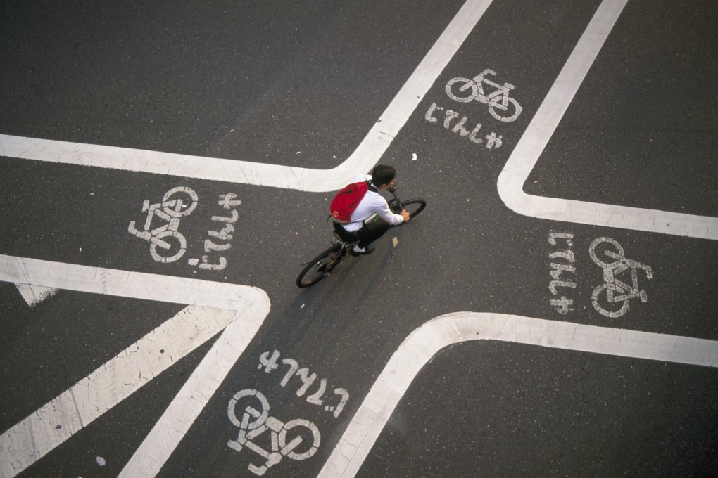 A cyclist in Tokyo. Japan recently enacted a law on dangerous cycling. Photo: B.S.P.I./Corbis