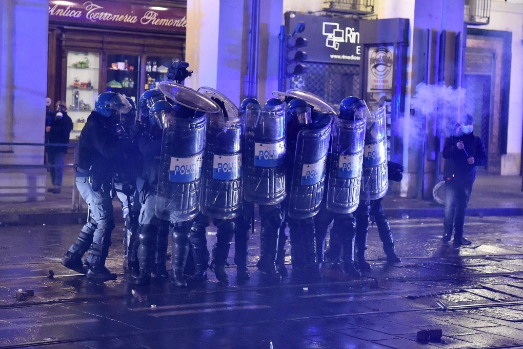 Clashes between demonstrators and police in Turin, Italy. Photo: EPA