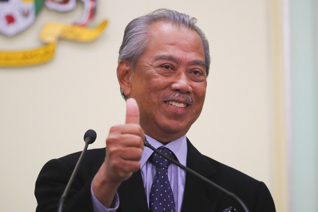 Malaysia's Prime Minister Muhyiddin Yassin gestures after the March announcement of his cabinet. Photo: EPA