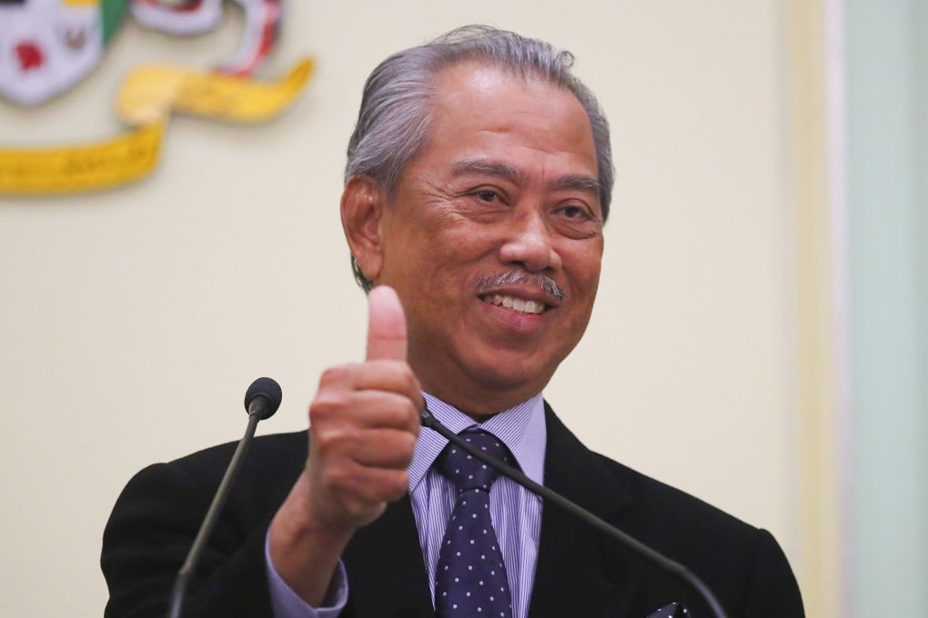 Malaysia's Prime Minister Muhyiddin Yassin gestures after the March announcement of his cabinet. Photo: EPA