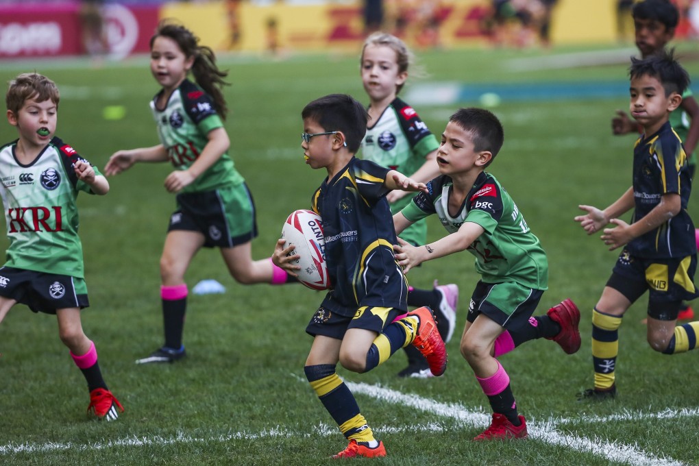 Boys and girls play together in a mini rugby game at the Hong Kong Sevens in 2019. Photo: Jonathan Wong