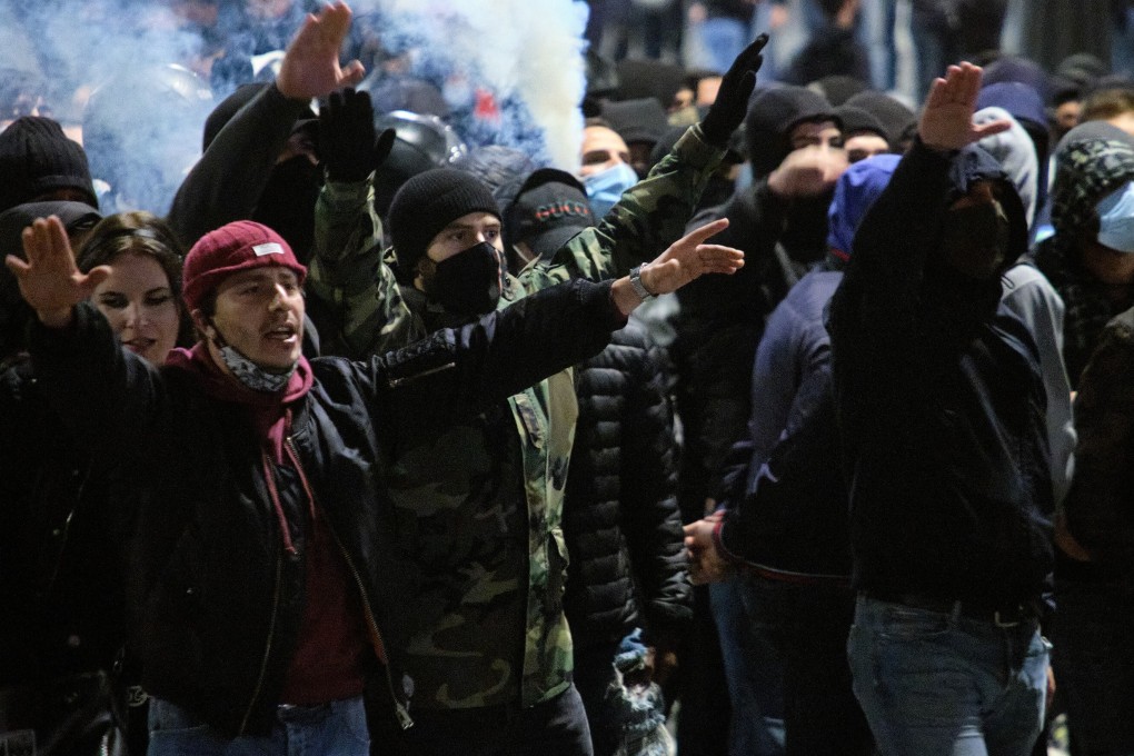 Protests against coronavirus restrictions are spreading across Italy, with violent incidents in Milan, Turin and Rome. Photo: EPA