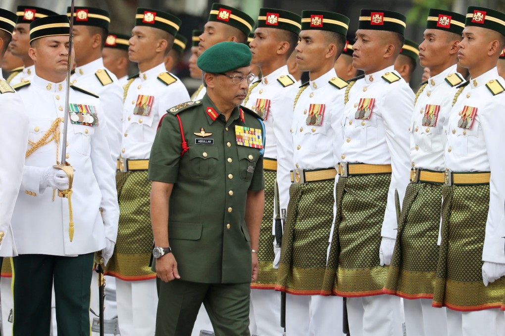 Malaysia's King, Al-Sultan Abdullah inspects a guard of honour. Photo: Reuters