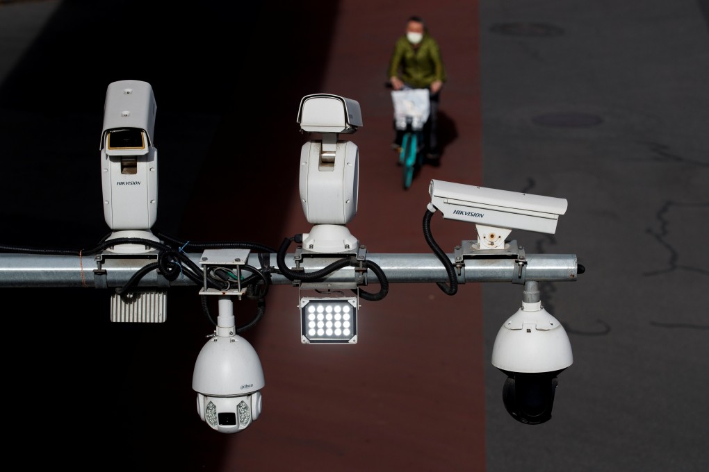 An array of surveillance cameras overlook a street in Beijing. Photo: Reuters