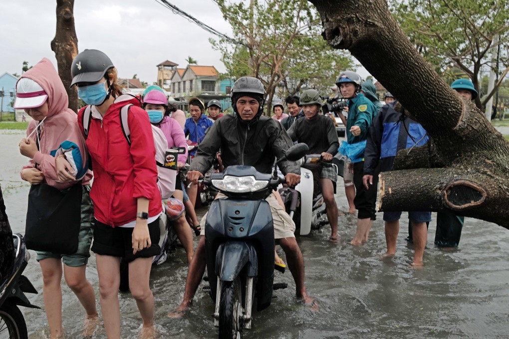 Hoi An residents commute in the aftermath of Typhoon Molave. Photo: EPA