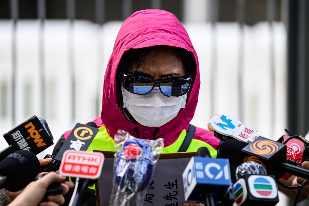 The mother of Poon Hiu-wing reads out a letter to Secretary for Security John Lee outside the government headquarters in Hong Kong on October 20, as she continues her campaign to seek justice over her pregnant daughter’s 2018 murder. Photo: AFP