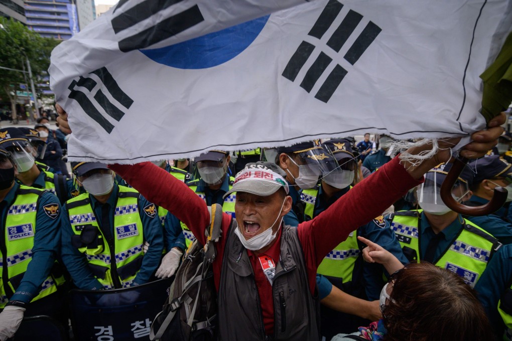 A conservative anti-government protester shouts slogans during an attempted rally in the central Gwanghwamun district of Seoul on “Foundation Day”. Photo: AFP
