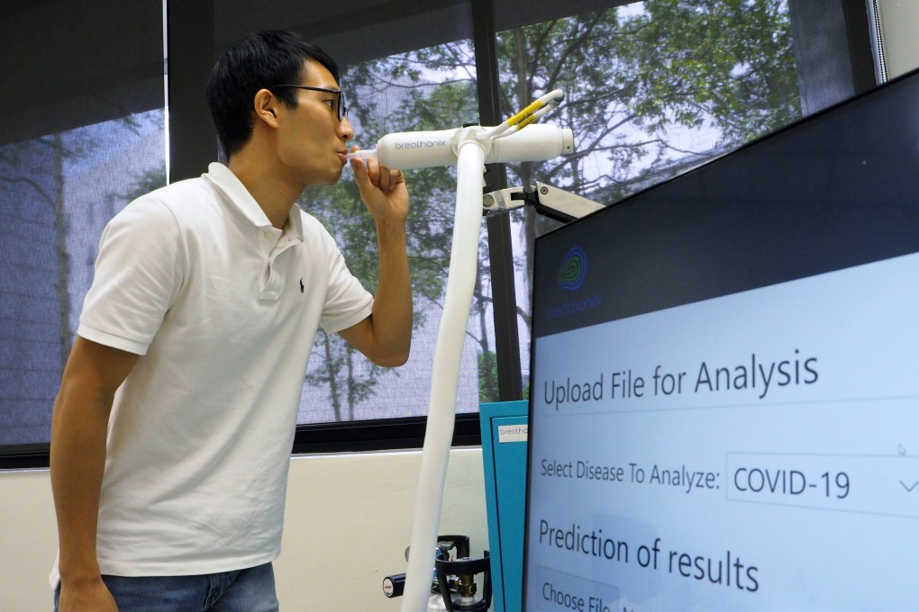 A member of staff demonstrates the breathalyser test kit developed by Breathonix at its laboratory in Singapore on Thursday. Photo: Reuters