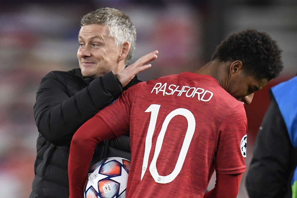Marcus Rashford of Manchester United is congratulated by manager Ole Gunnar Solskjaer after their Uefa Champions League victory against RB Leipzig. Photo: EPA