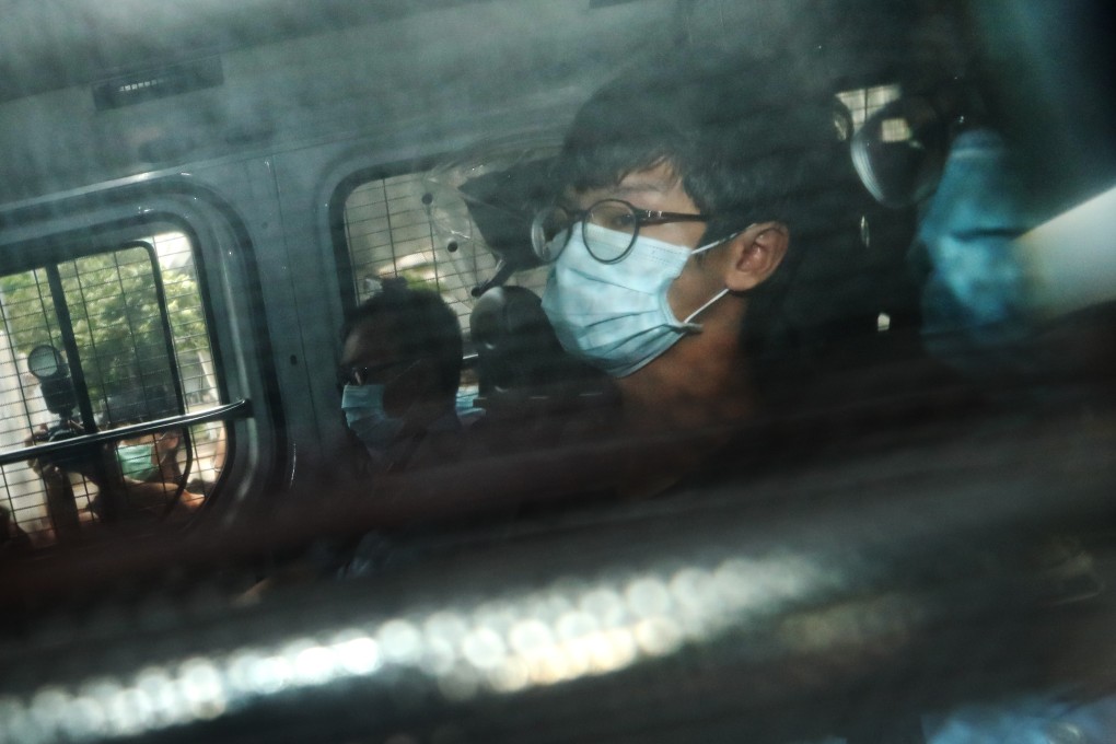 Tony Chung, former convenor of the now-defunct Studentlocalism group, is escorted by police to West Kowloon Court charged with secession under the national security law, October 29, 2020. Photo: Sam Tsang