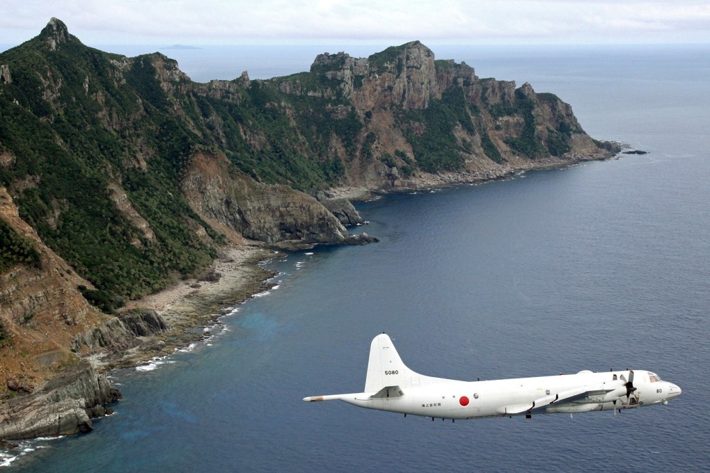 A Japanese surveillance drone flies over the disputed islands known as the Senkakus in Japan and the Diaoyus in China. Photo: AP