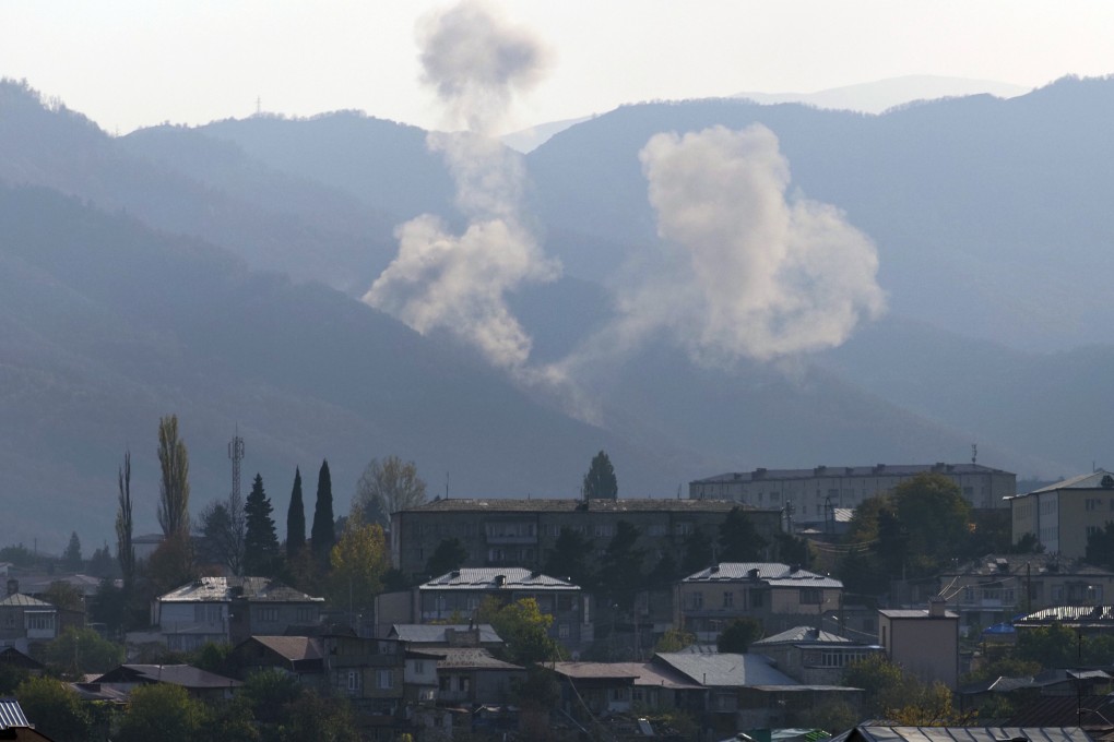 Smoke rises after shelling by Azerbaijan’s artillery during a military conflict outside Stepanakert, the breakaway region of Nagorno-Karabakh, on Thursday. Photo: AP