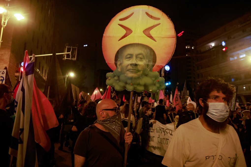 Protesters gather near the residence of Israeli Prime Minister Benjamin Netanyahu in Jerusalem on Saturday to demand his resignation over his corruption cases. Photo: AFP