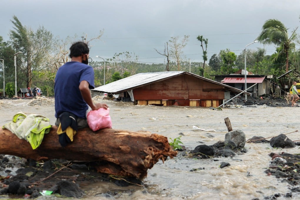 A man looks at his flooded house in Albay province after Typhoon Goni hit the Philippines. Photo: Reuters